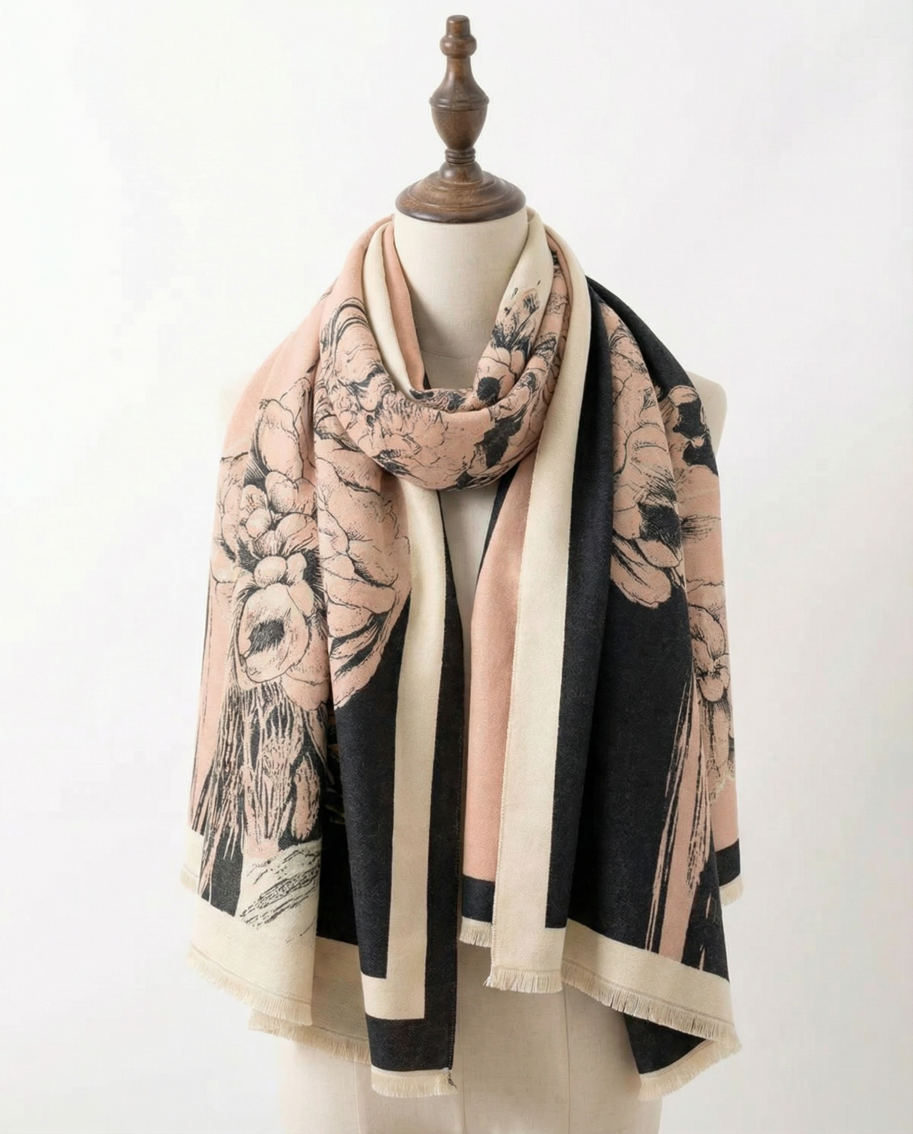 Wrap with floral pattern draped over a mannequin on a white background