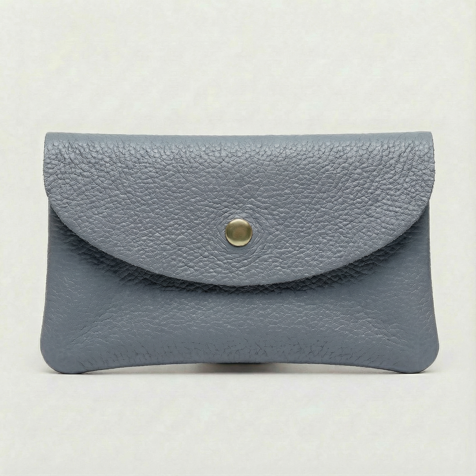 Denim color leather cellphone wallet with a gold button on a white background
