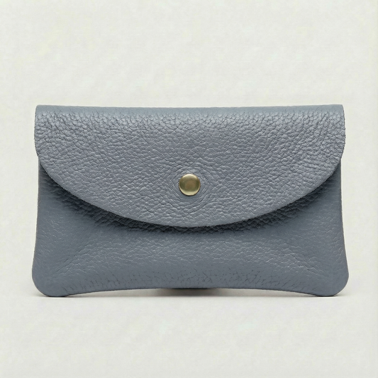 Denim color leather cellphone wallet with a gold button on a white background