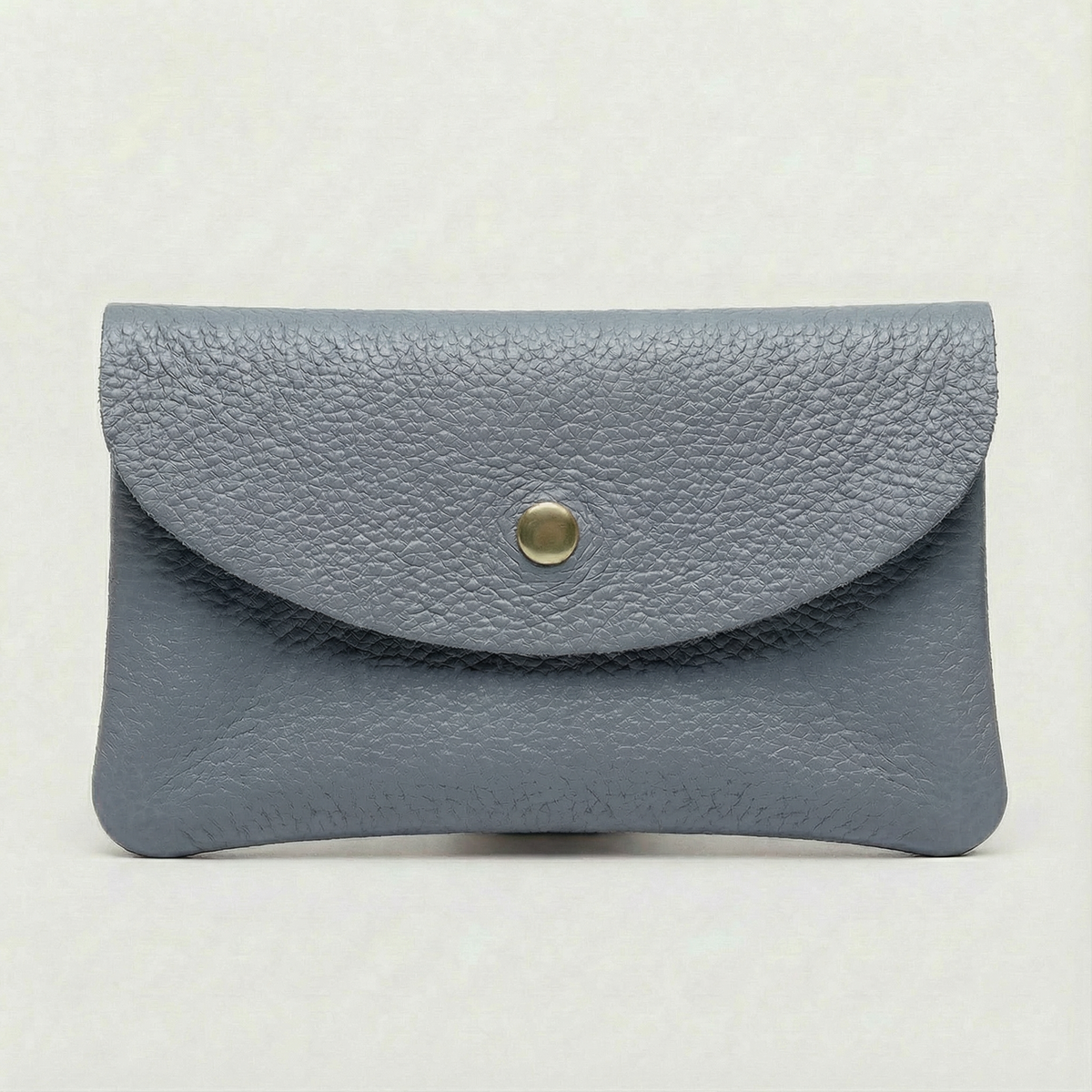 Denim pebble leather wallet collection featuring Mini Coin Wallet, Coin Wallet, and Cellphone Wallet in genuine leather, made in Italy.