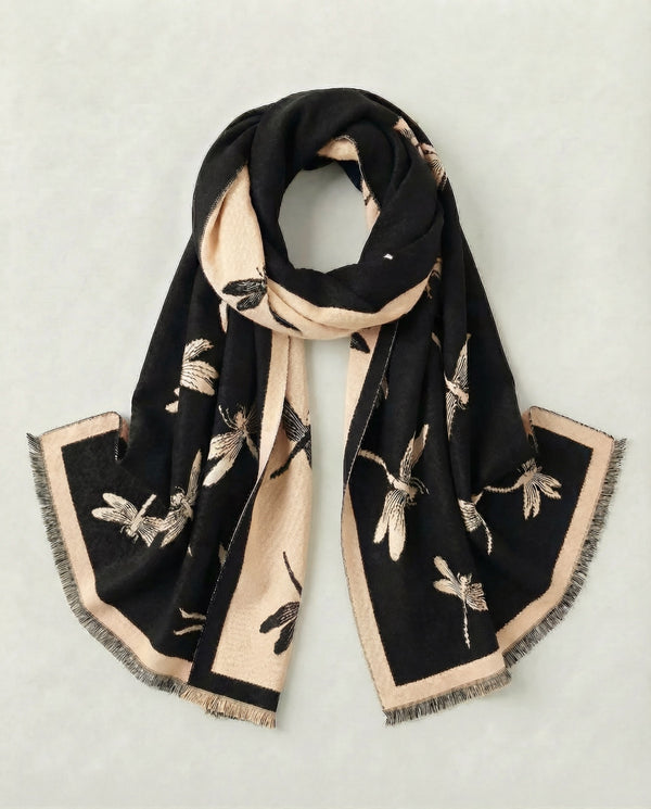 Black and beige scarf with dragonfly motif on a light gray background