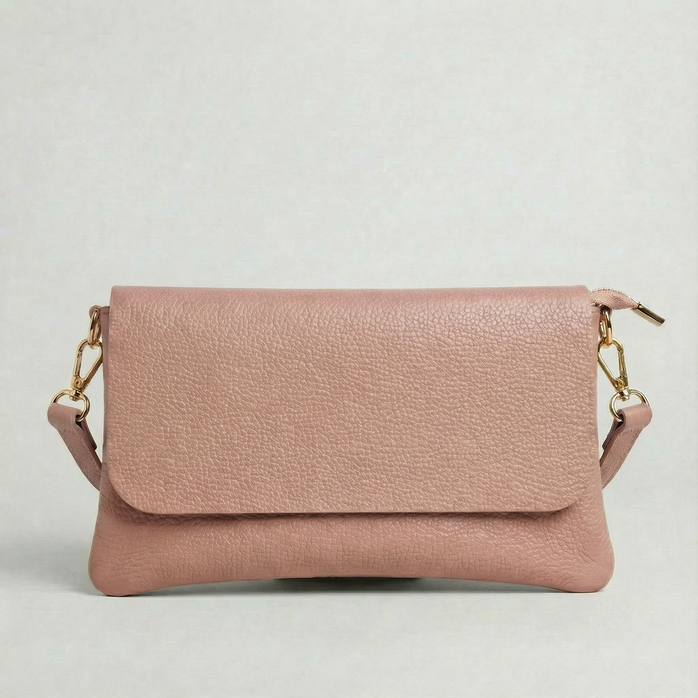 Dusty Rose pebble leather crossbody bag with a matching color adjustable strap, displayed on a light gray background.