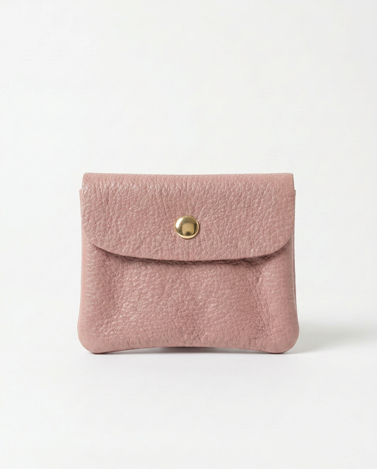 Dusty Pink leather wallet with a gold clasp on a light gray background
