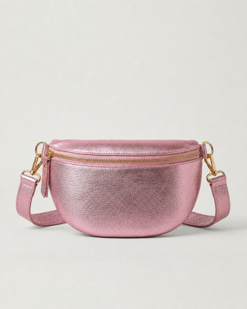 Metallic leather fanny bag in Barbie pink with adjustable strap and sleek, compact silhouette designed for hands‑free everyday wear.