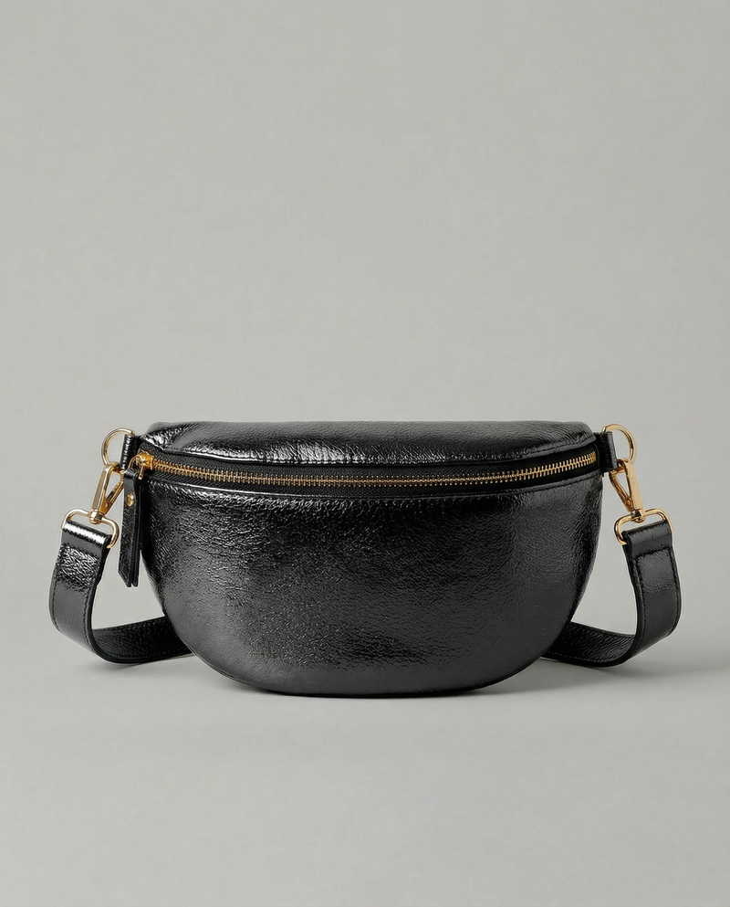 Metallic leather fanny bag in black with adjustable strap and sleek, compact silhouette designed for hands‑free everyday wear.