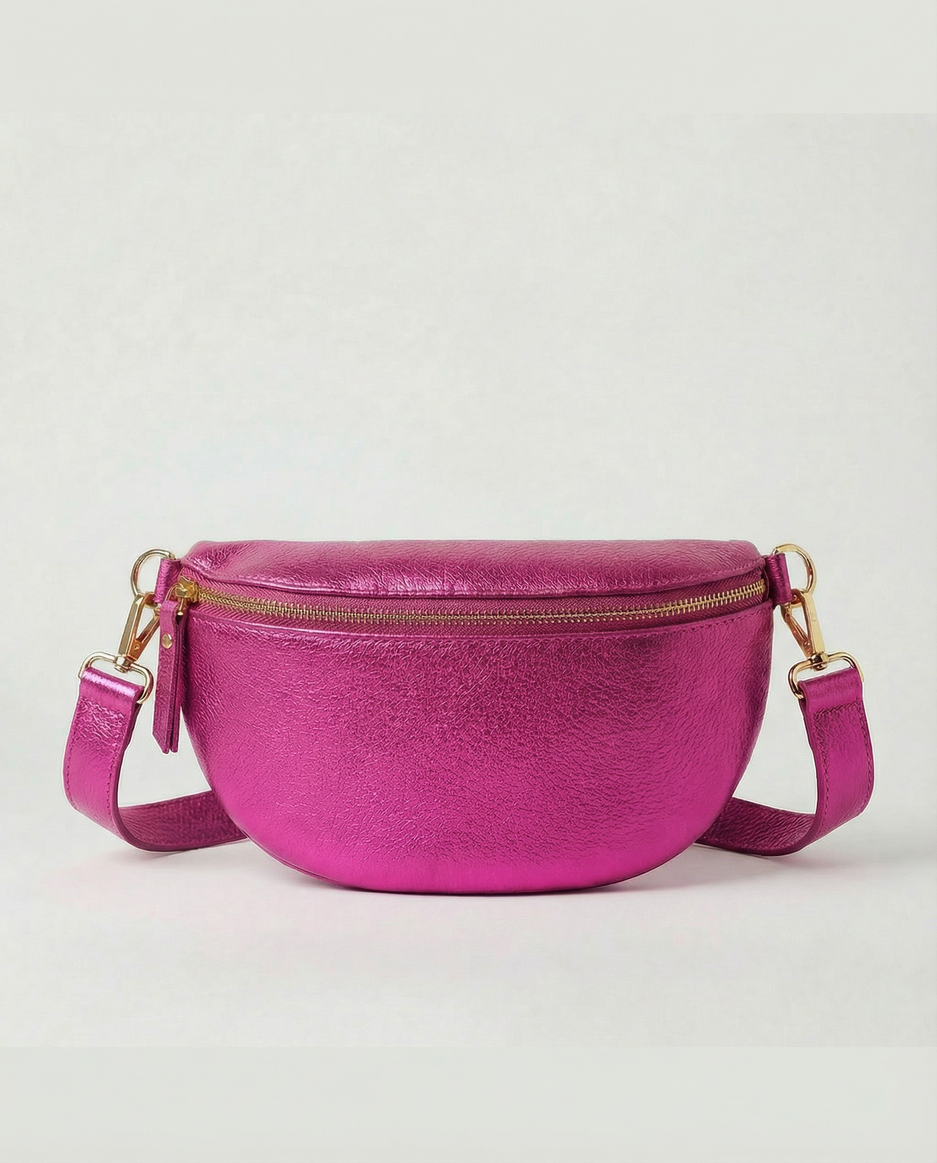 Metallic leather fanny bag in magenta with adjustable strap and sleek, compact silhouette designed for hands‑free everyday wear.