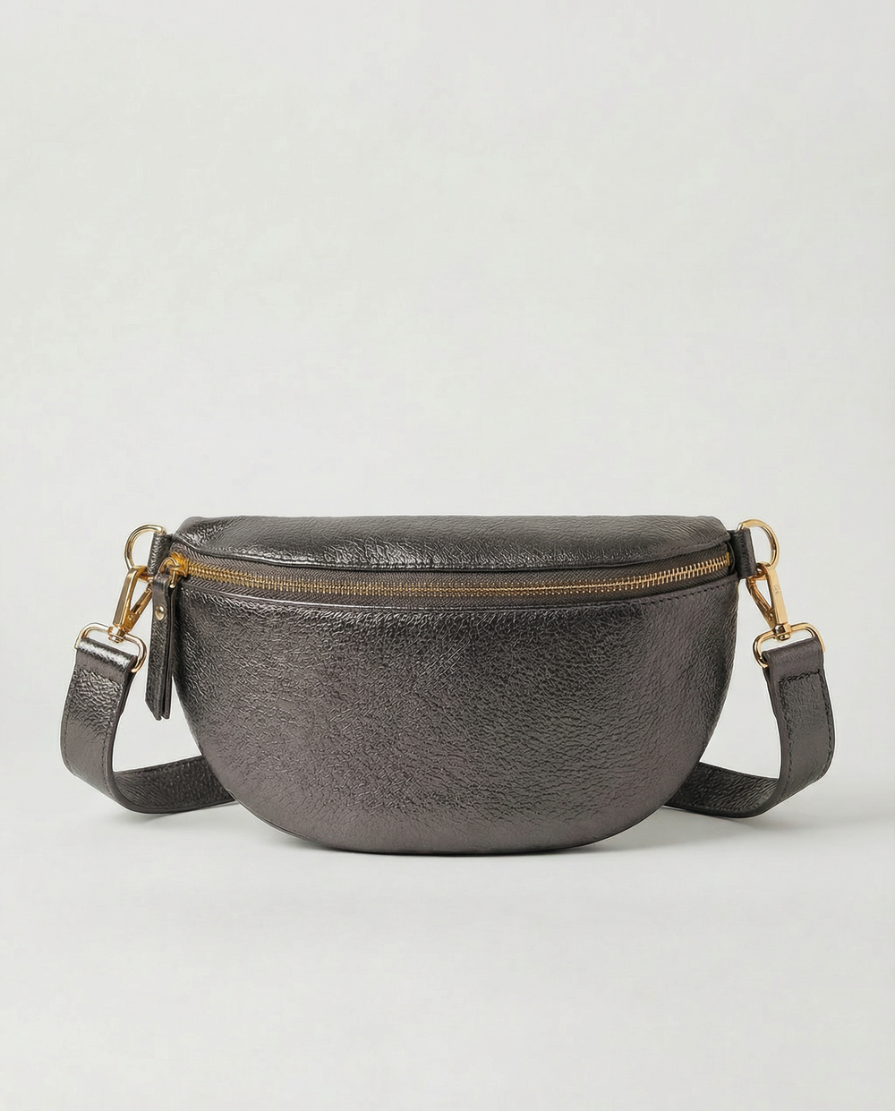 Metallic leather fanny bag in pewter with adjustable strap and sleek, compact silhouette designed for hands‑free everyday wear.