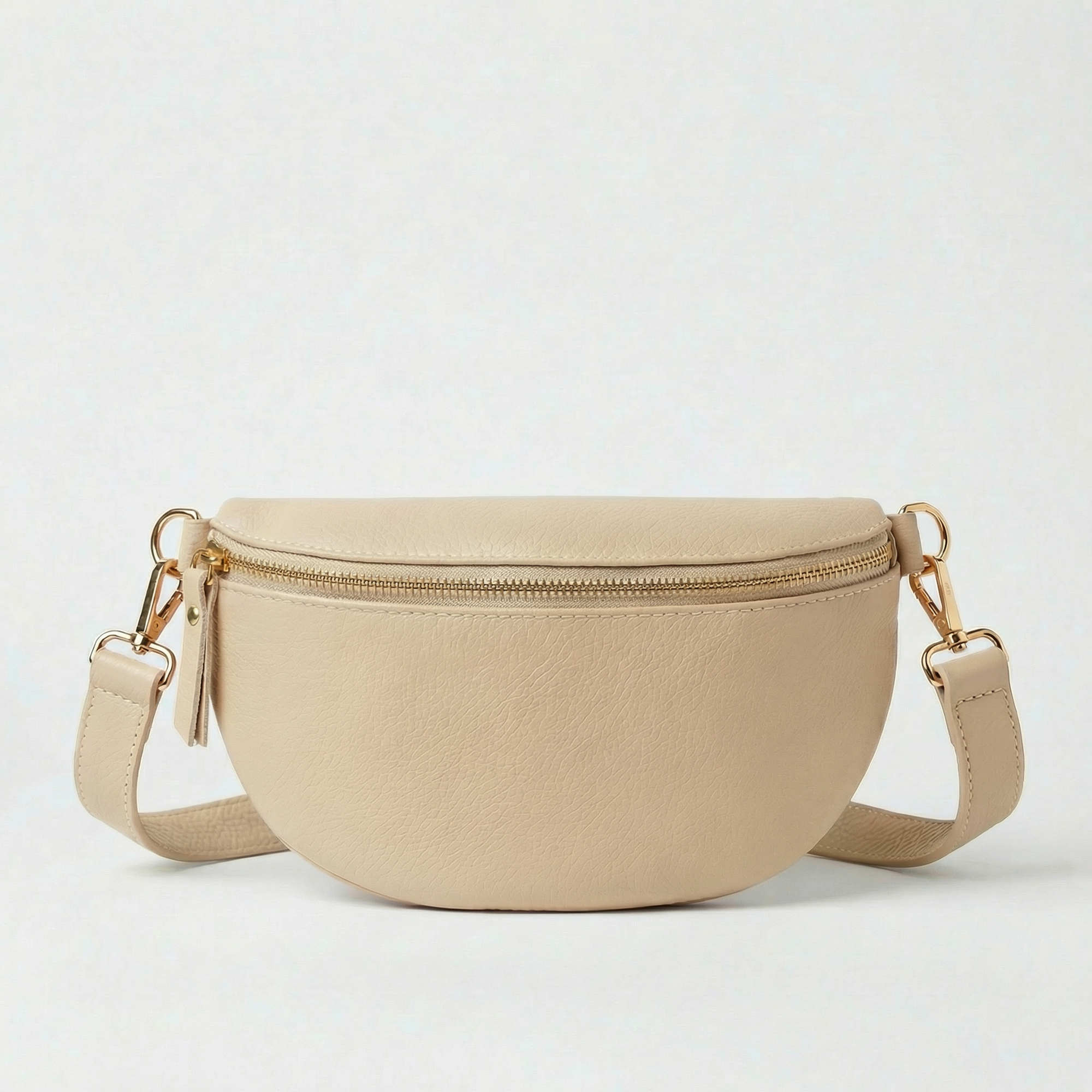 Beige pebble leather fanny bag with adjustable strap and compact, hands‑free design.