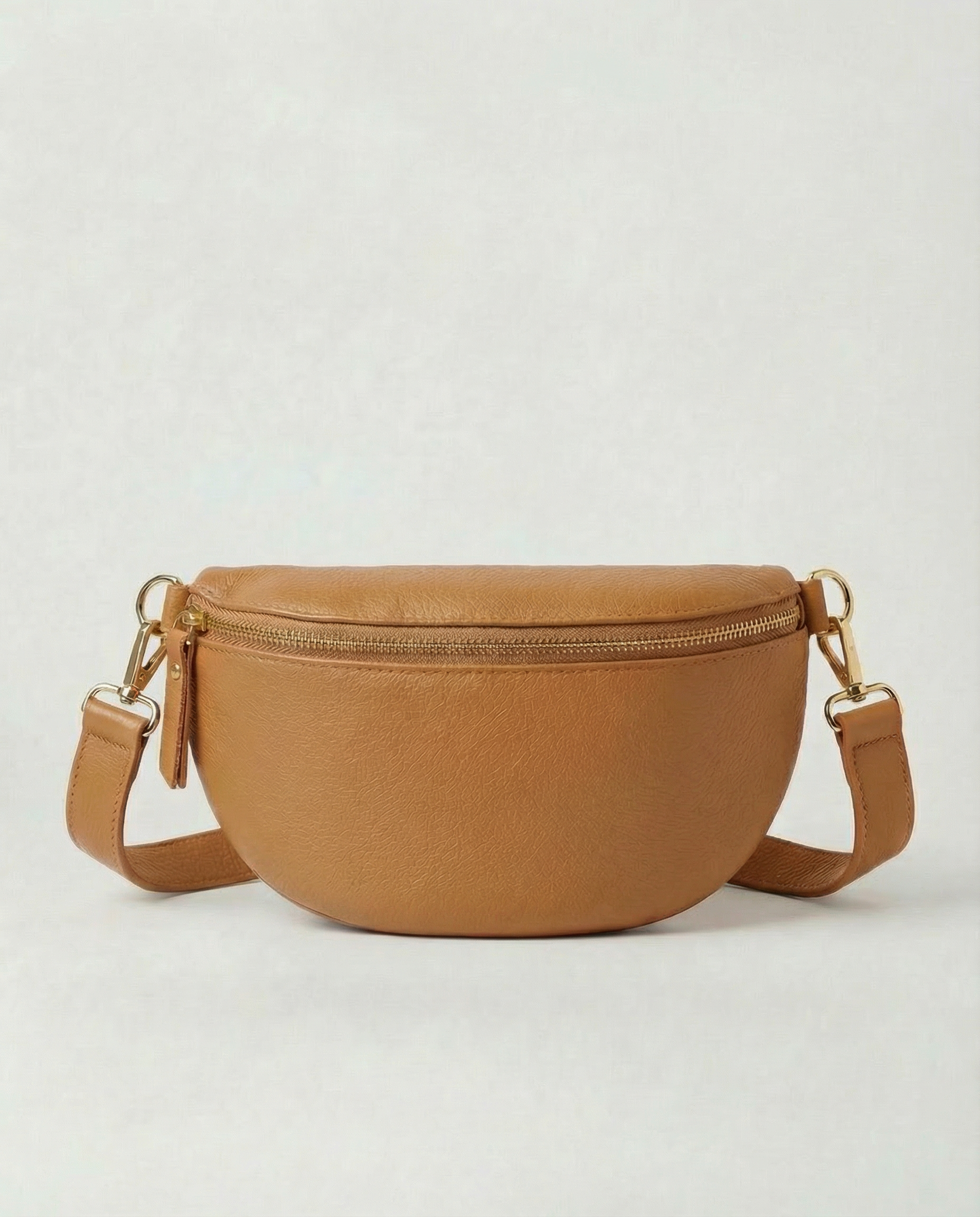 Camel pebble leather fanny bag with adjustable strap and compact, hands‑free design.