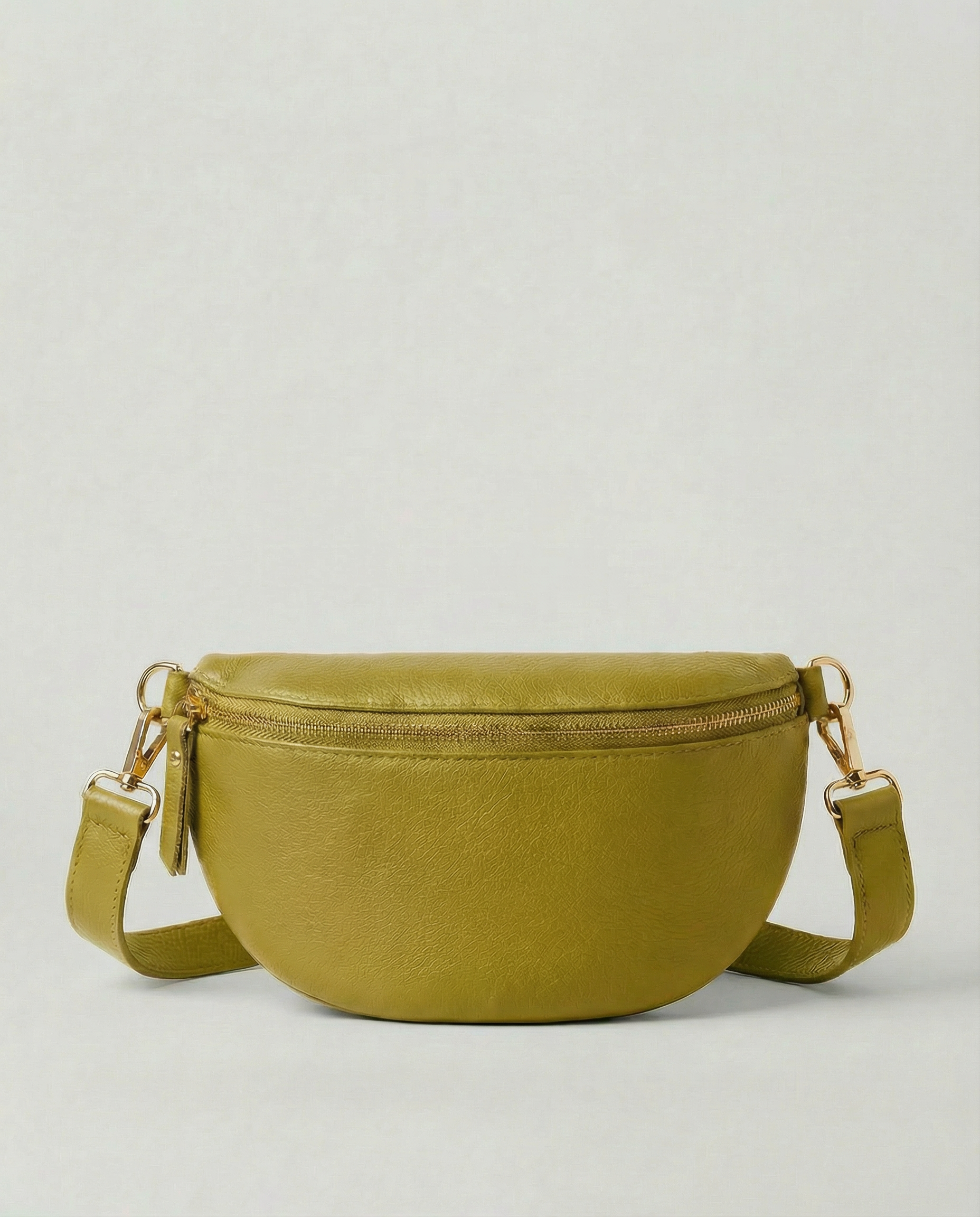 Chartreuse pebble leather fanny bag with adjustable strap and compact, hands‑free design.