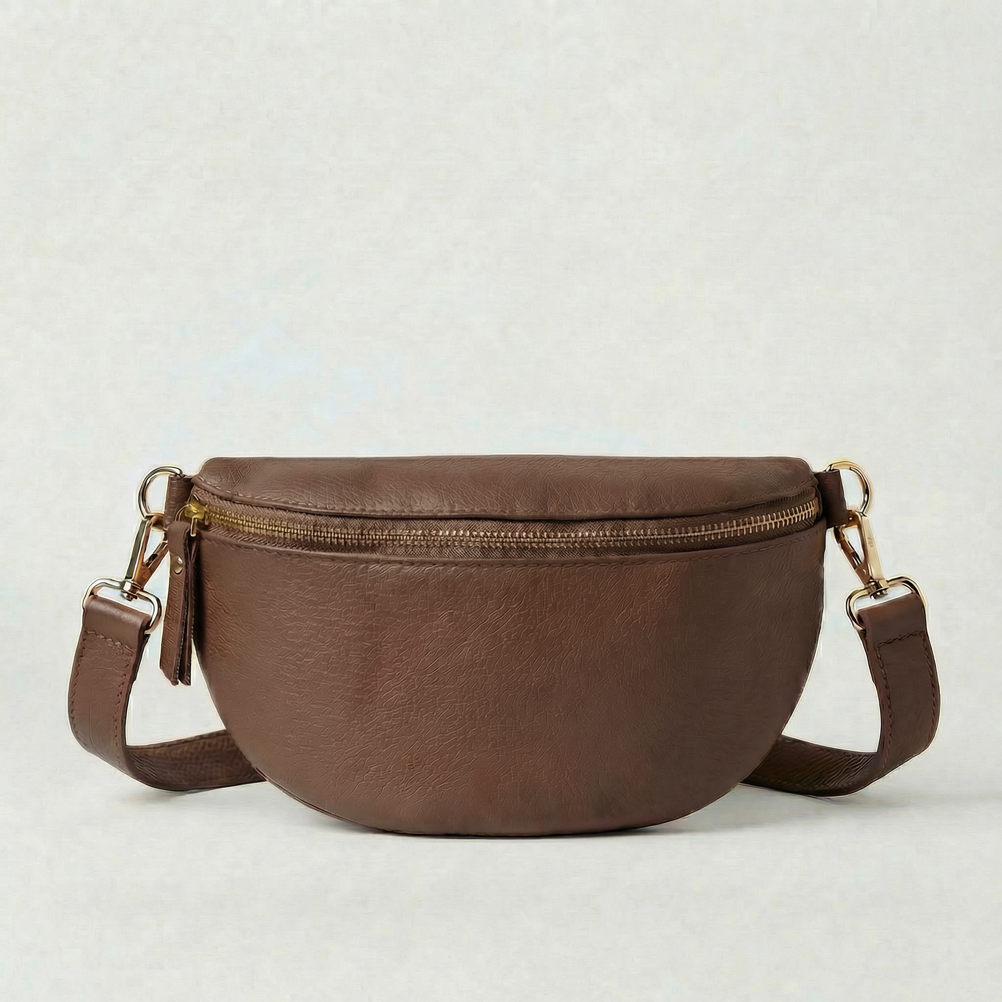 Chocolate pebble leather fanny bag with adjustable strap and compact, hands‑free design.