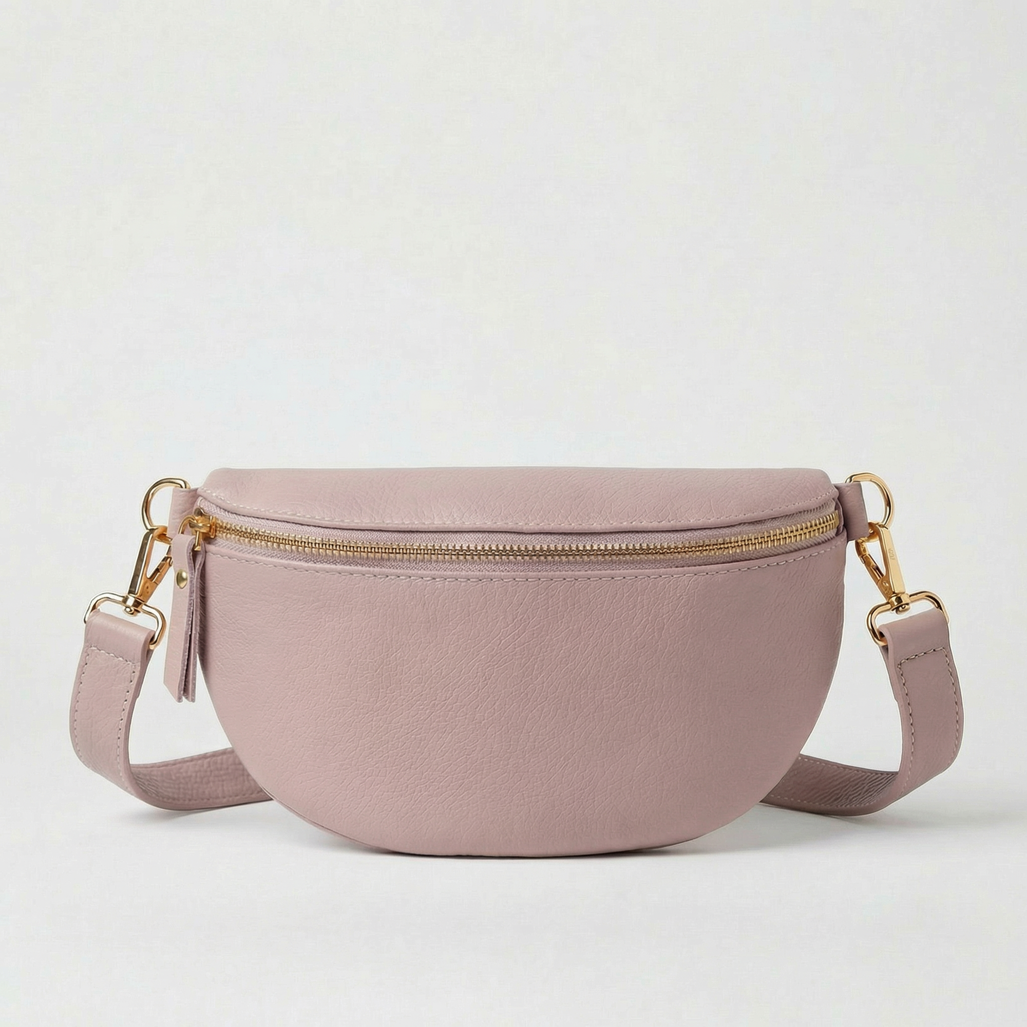 Lilac pebble leather fanny bag with adjustable strap and compact, hands‑free design.