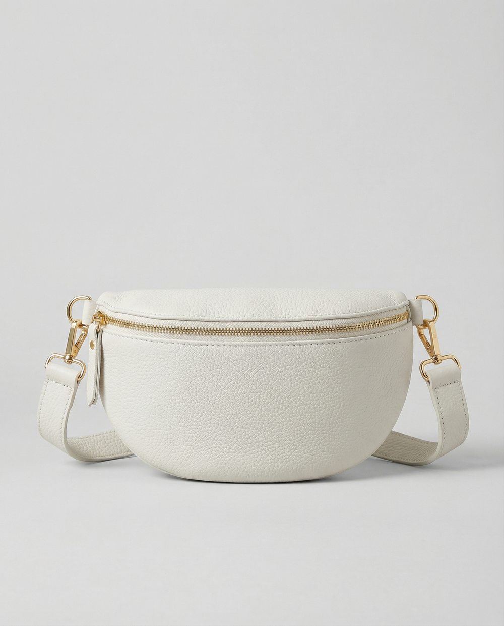 Whited pebble leather fanny bag with adjustable strap and compact, hands‑free design.