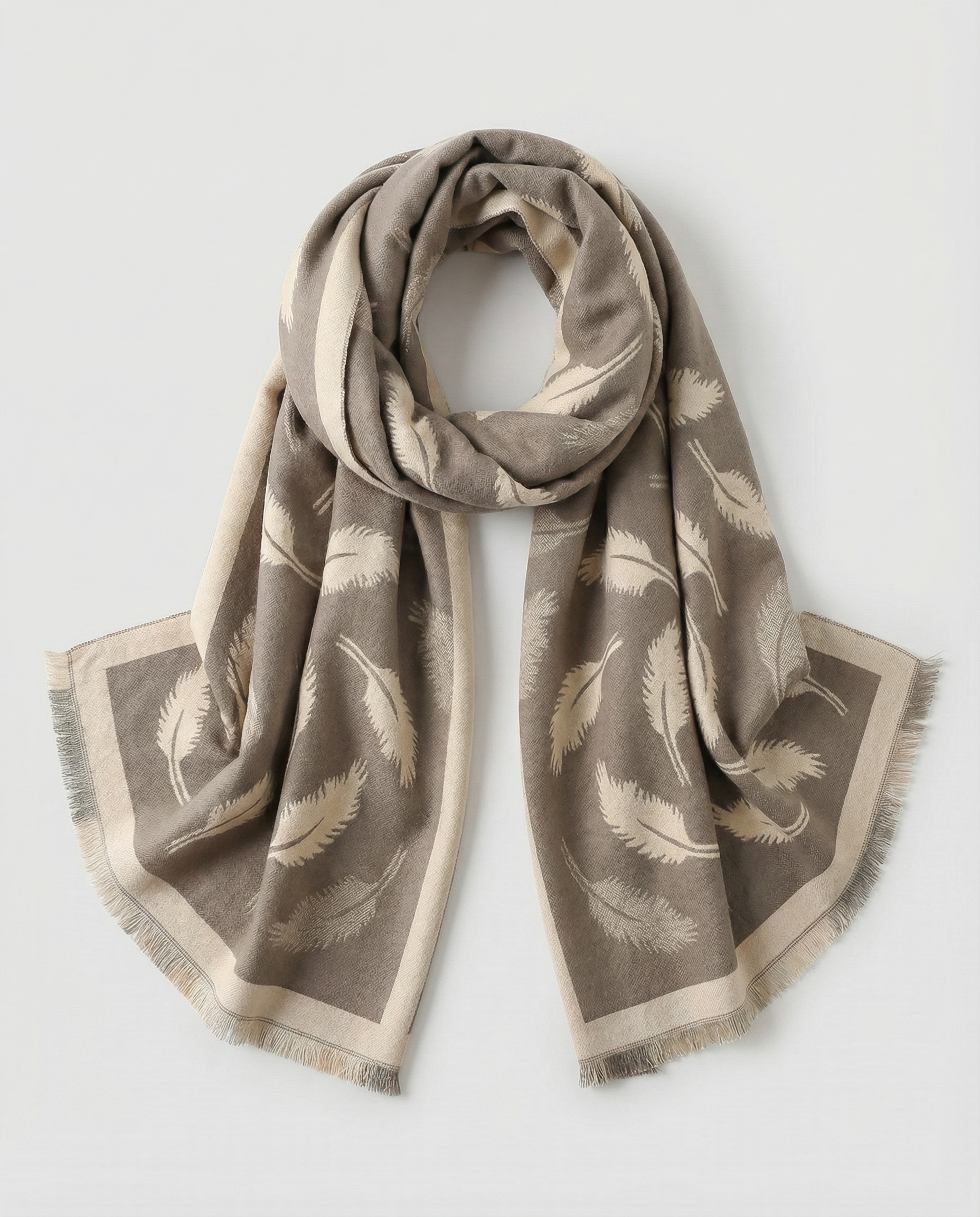 Beige and brown wrap with feather pattern on a light gray background