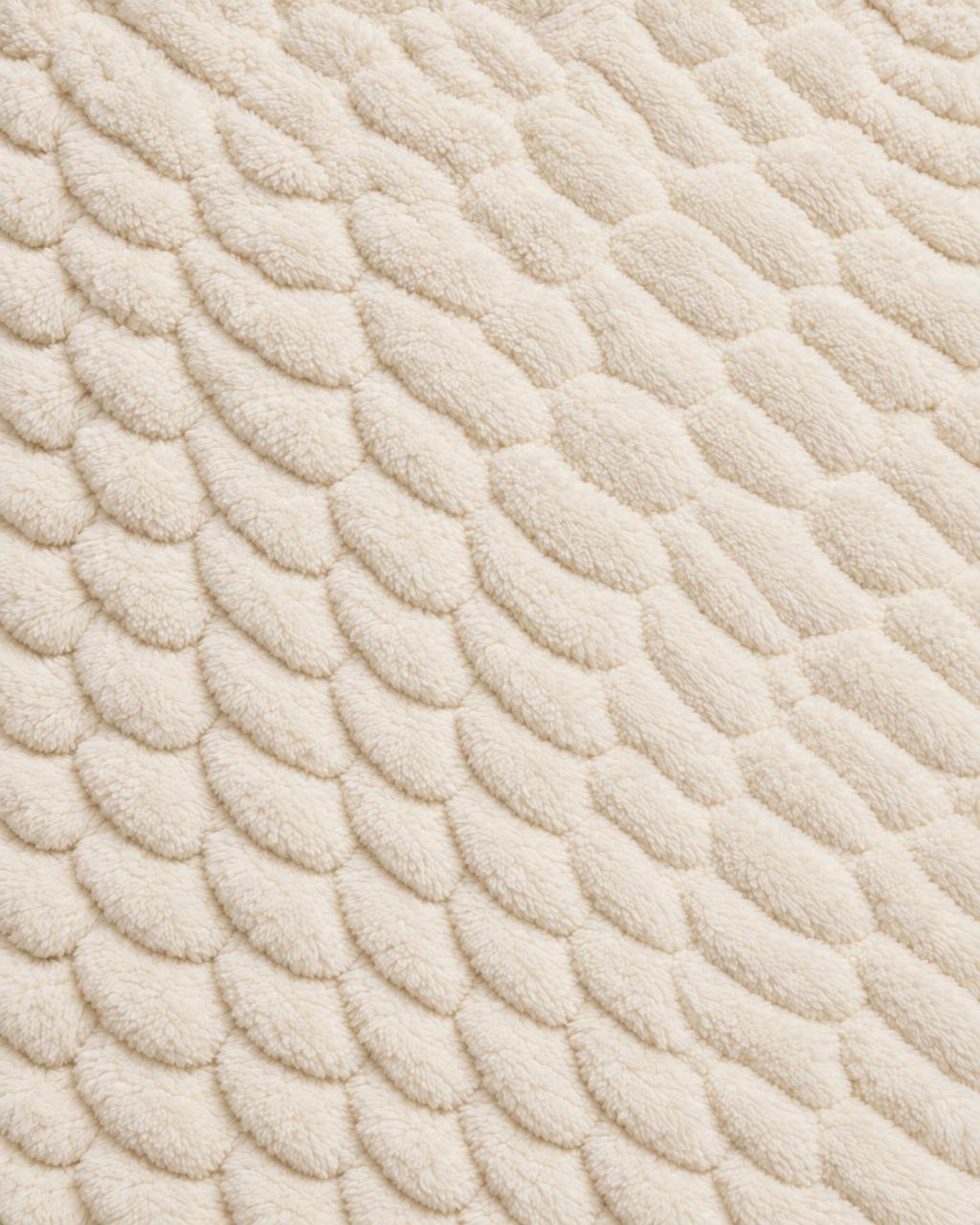 Florence Throw in Ivory with a soft, plush texture.