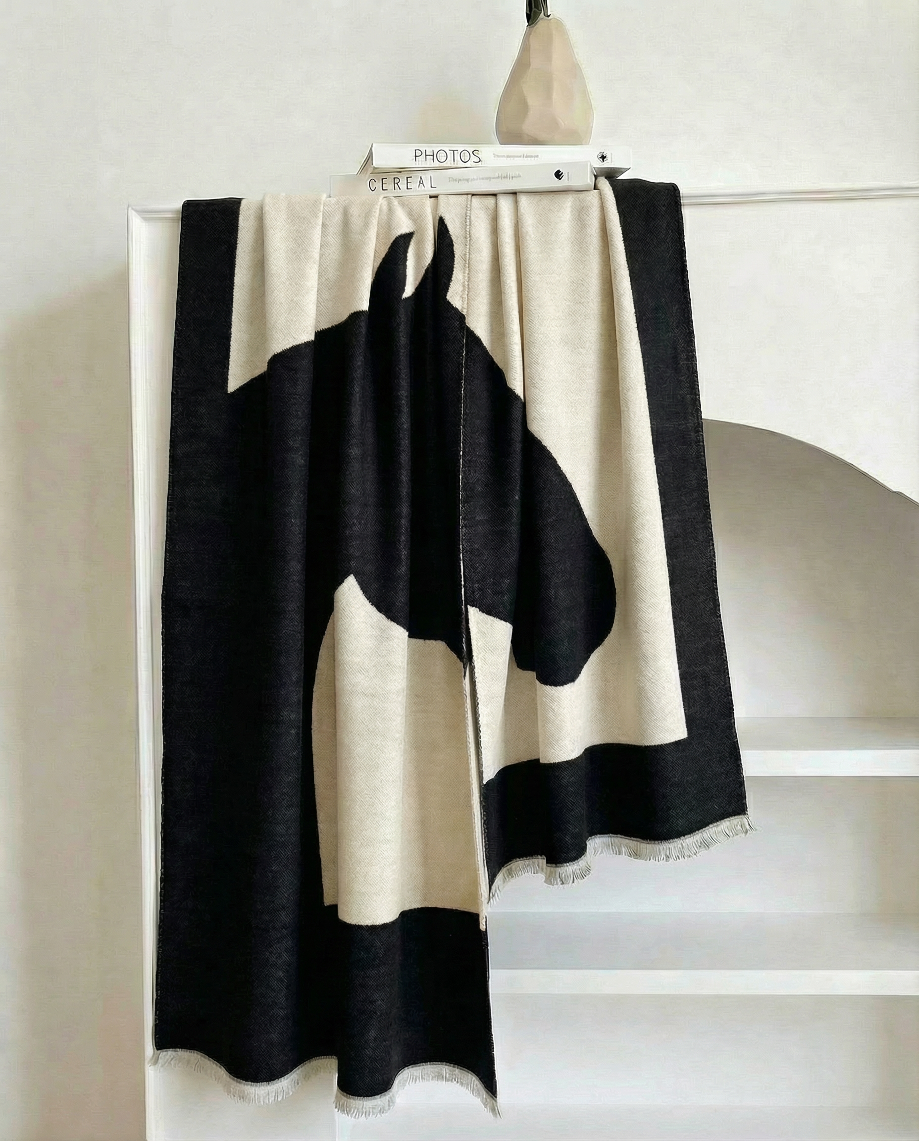 Black and beige wrap with horse design on a white background