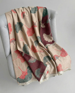 Decorative wrap with floral pattern draped over a chair, view 2