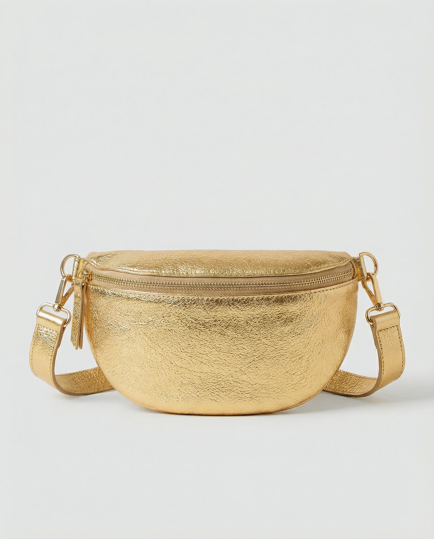 Metallic leather fanny bag in gold with adjustable strap and sleek, compact silhouette designed for hands‑free everyday wear.