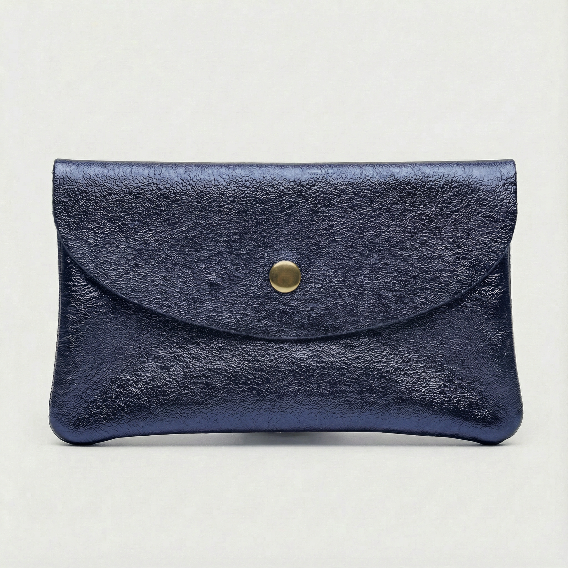 Indigo  metallic leather coin wallet with textured finish, snap closure, compact Italian‑made design, stylish everyday accessory