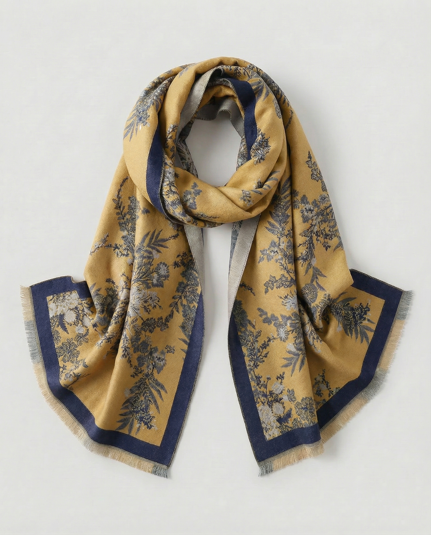 Yellow and blue patterned scarf on a light gray background