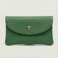 Kelly green leather wallet with a gold button on a light gray background, view 1