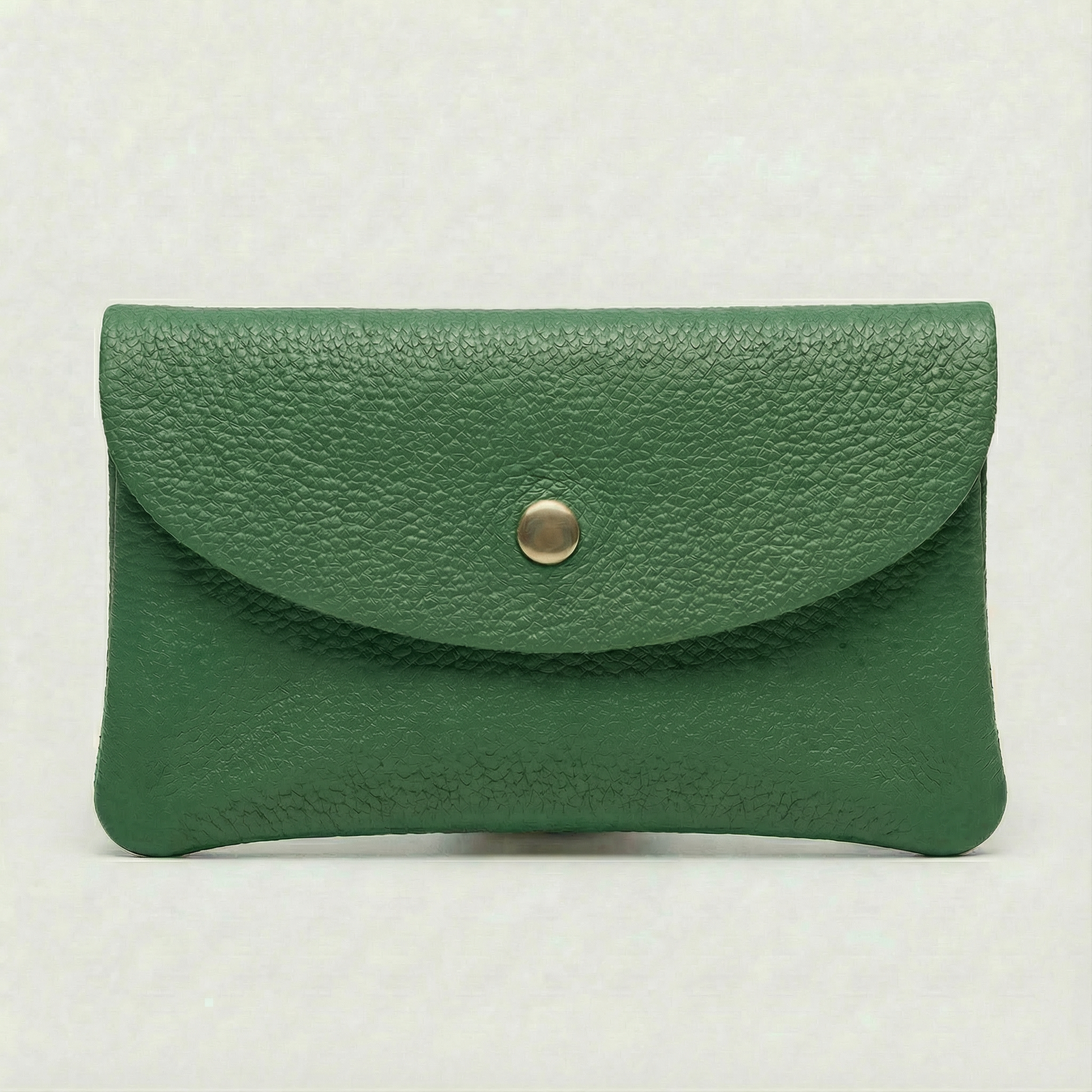 Kelly green pebble leather mini coin wallet with snap closure, compact Italian‑made design for coins and small essentials

