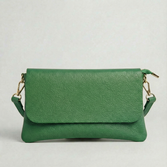 Kelly Green pebble leather crossbody bag with a matching color adjustable strap, displayed on a light gray background.