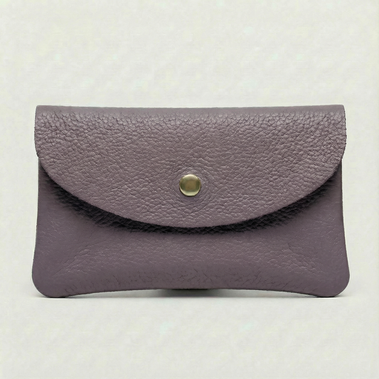 Lavender color leather cellphone wallet with a gold button on a white background.