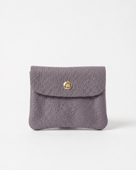 Lavender pebble leather mini coin wallet with snap closure, compact Italian‑made design for coins and small essentials
