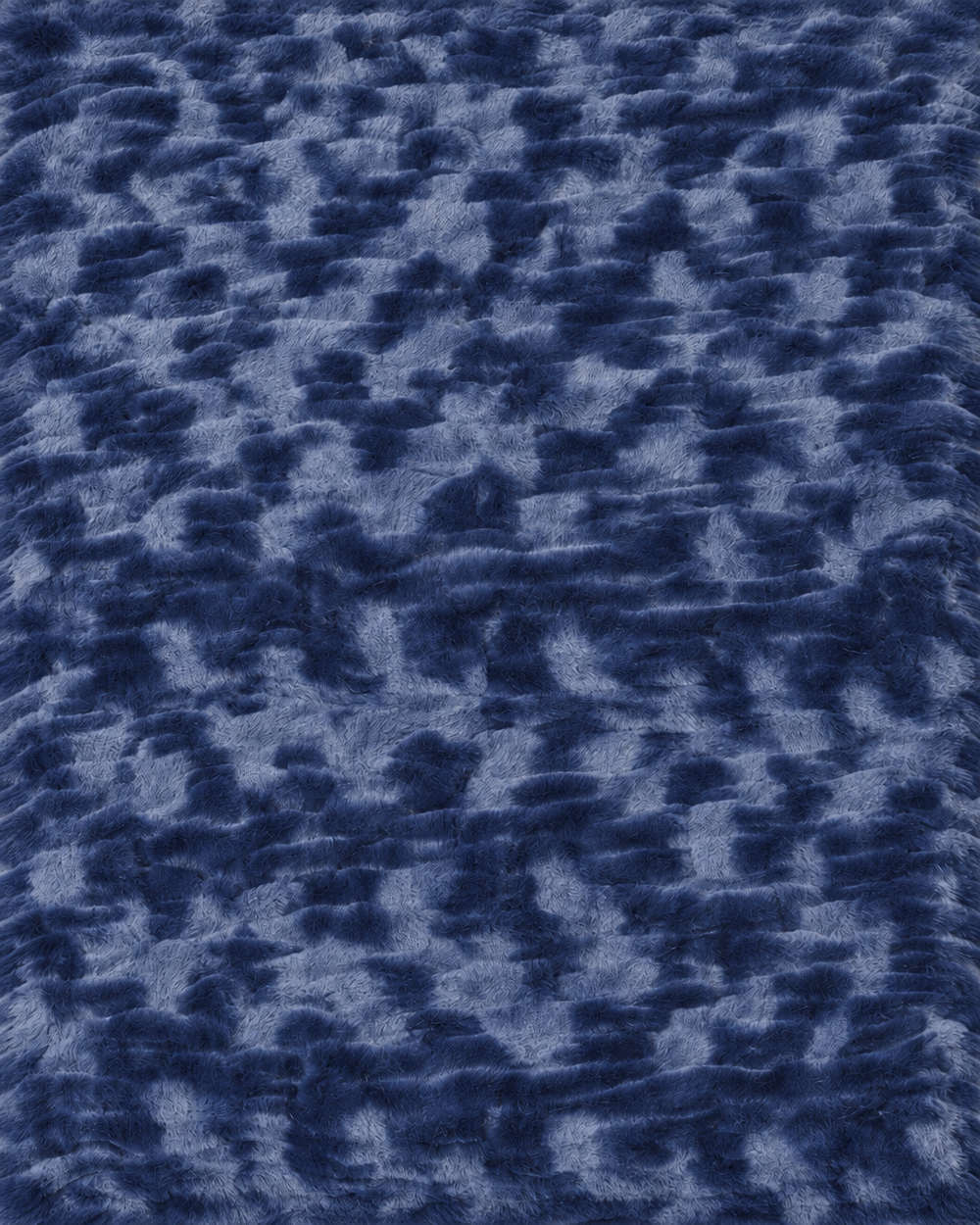 Le Marais Throw in Navy with a soft, luxurious texture.