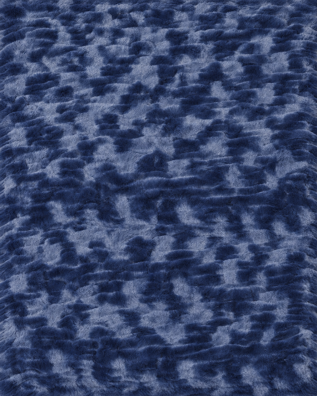 Le Marais Throw in Navy with a soft, luxurious texture.