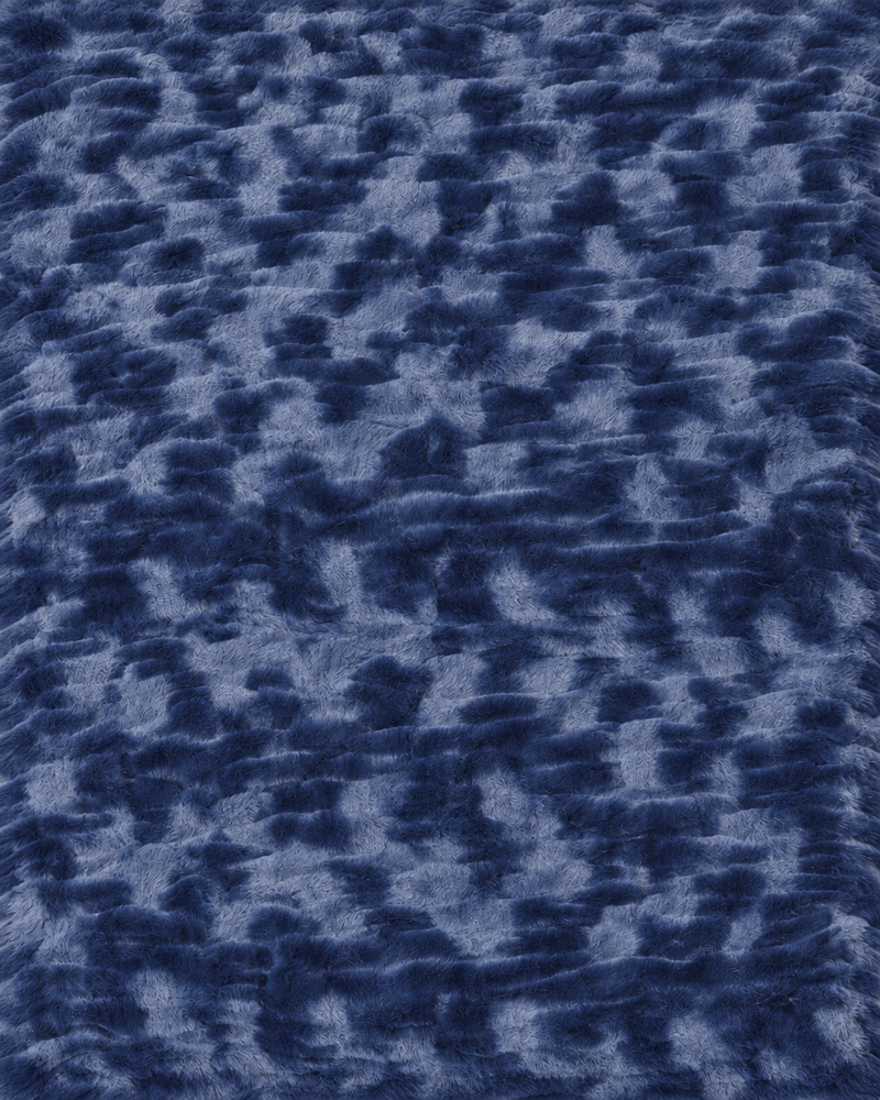 Le Marais Throw in Navy with a soft, luxurious texture.