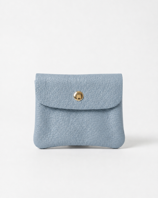 Light Blue pebble leather mini coin wallet with snap closure, compact Italian‑made design for coins and small essentials