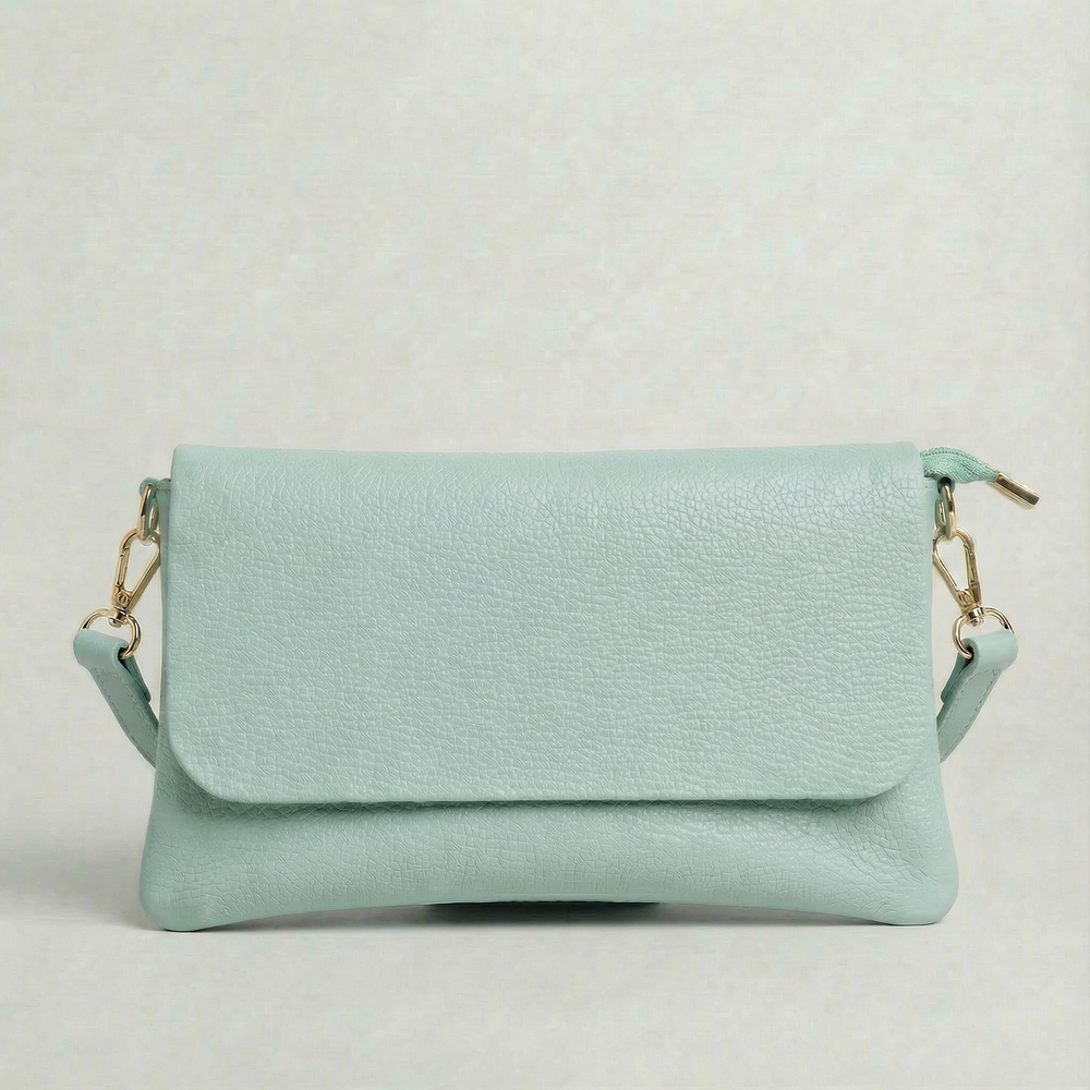 Light Blue pebble leather crossbody bag with a matching color adjustable strap, displayed on a light gray background.