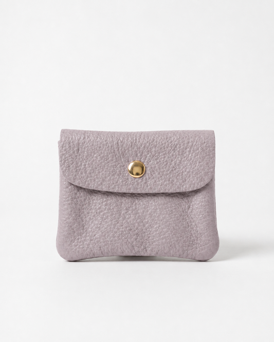 Lilac pebble leather mini coin wallet with snap closure, compact Italian‑made design for coins and small essentials