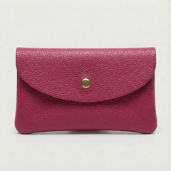 Magenta pebble leather wallet collection featuring Mini Coin Wallet, Coin Wallet, and Cellphone Wallet in genuine leather, made in Italy., view 1