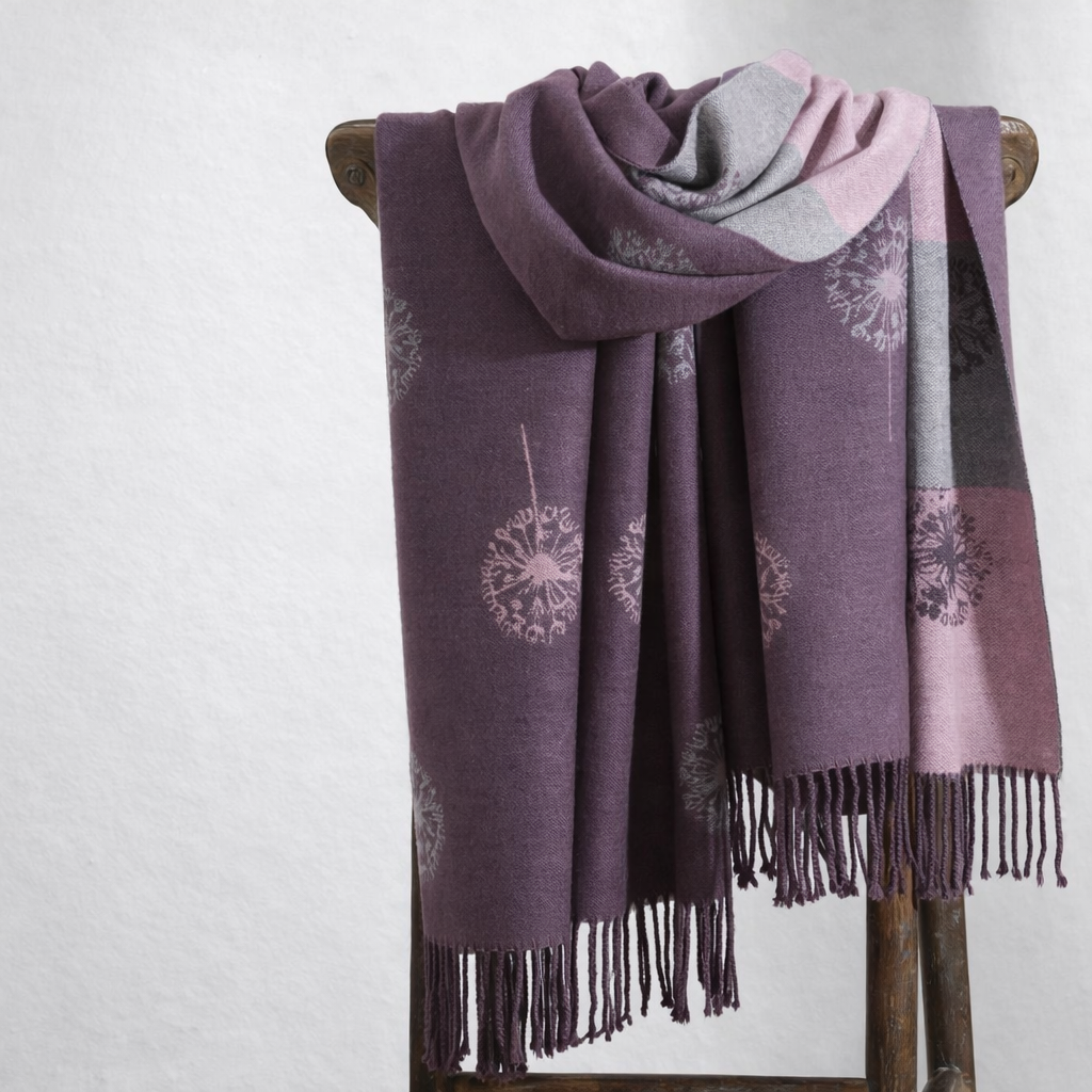 Purple wrap draped over a wooden rod against a white background