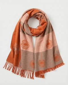 Orange wrap with pattern and fringes on a light background, view 1
