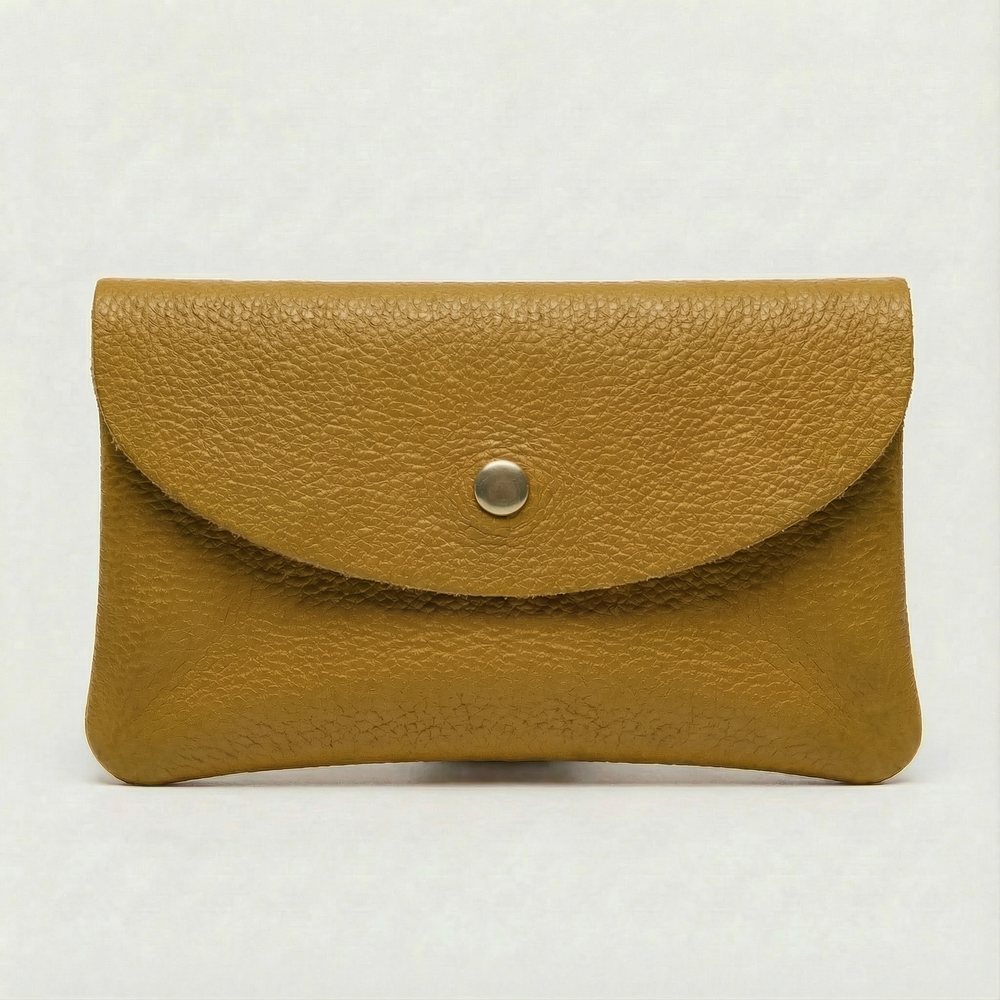 Mustard pebble leather wallet collection featuring Mini Coin Wallet, Coin Wallet, and Cellphone Wallet in genuine leather, made in Italy.