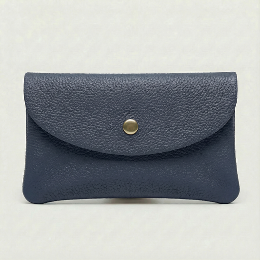 Navy pebble leather coin wallet with snap closure, minimalist Italian design, compact and elegant everyday accessory.