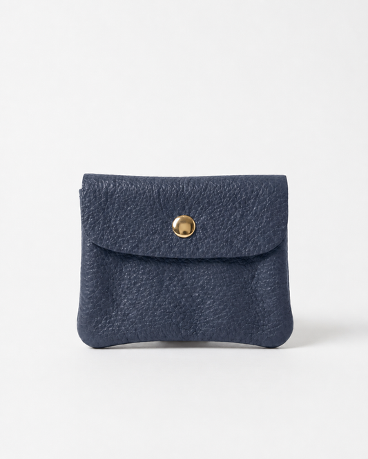 Navy pebble leather mini coin wallet with snap closure, compact Italian‑made design for coins and small essentials