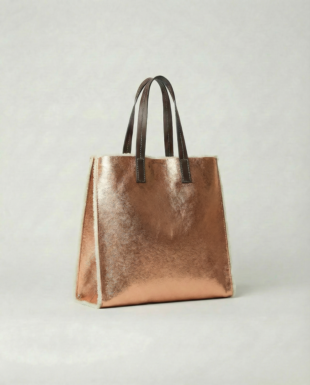 Mini Paris Tote in metallic copper leather with structured silhouette, top handles, and compact elegant design.