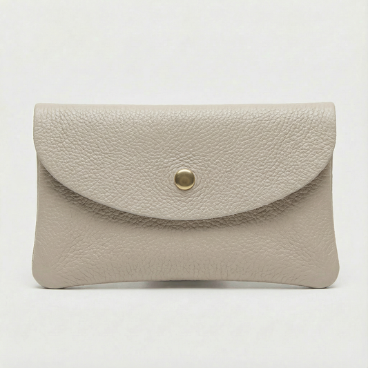 Platinum pebble leather coin wallet with snap closure, minimalist Italian design, compact and elegant everyday accessory.
