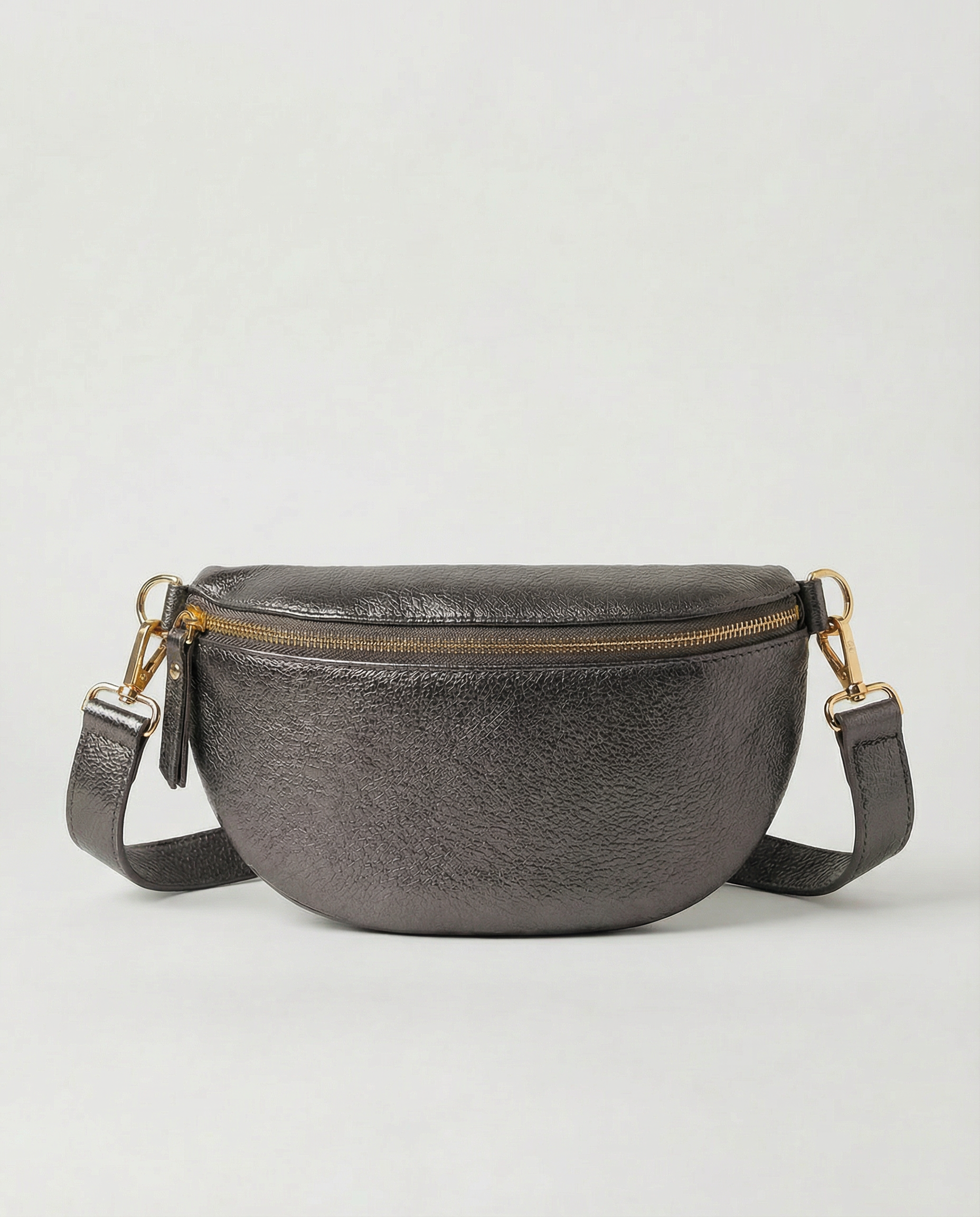 Metallic leather fanny bag in pewter with adjustable strap and sleek, compact silhouette designed for hands‑free everyday wear.