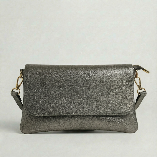 Pewter metallic leather crossbody bag with a matching color leather strap, displayed on a light gray background.