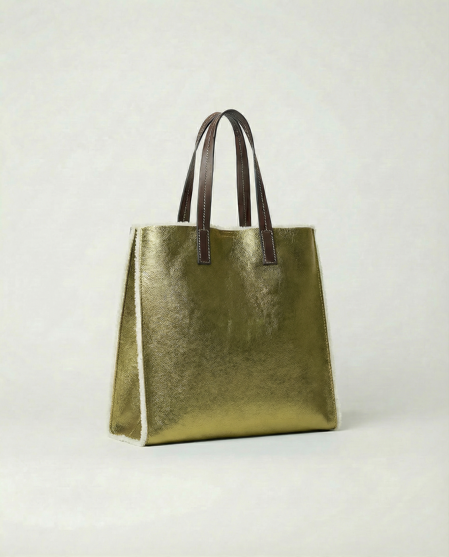 Metallic pistachio leather Paris tote bag available in Paris Tote and Mini Paris Tote sizes.