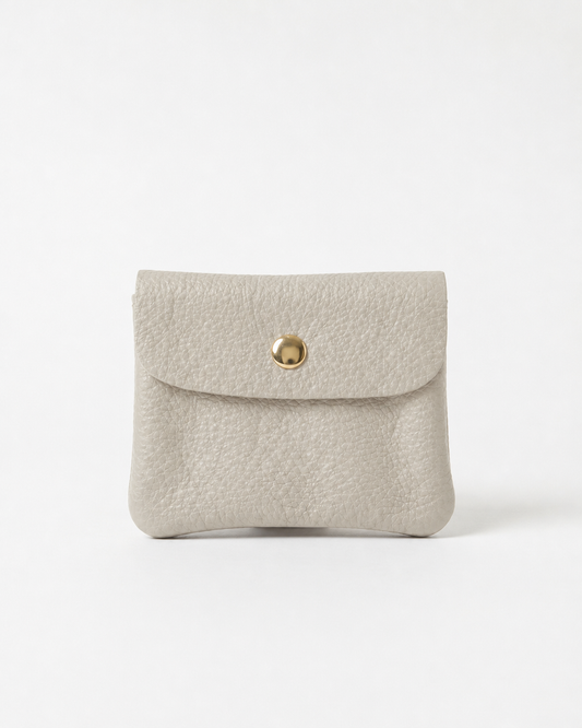 Platinum pebble leather mini coin wallet with snap closure, compact Italian‑made design for coins and small essentials