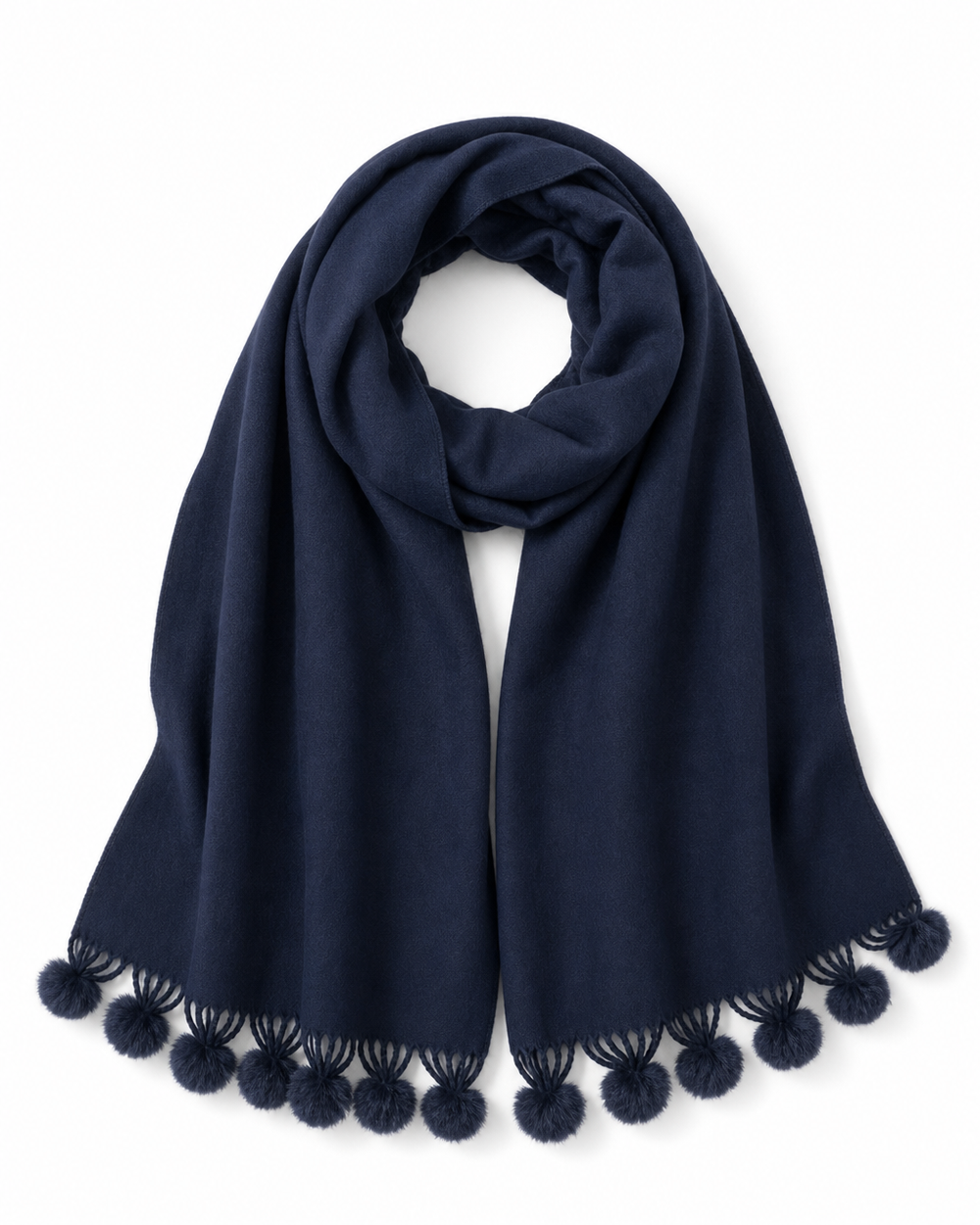 Soft navy pom pom wrap with an elegant drape and playful pom pom trim, perfect for layering over everyday or dressy outfits.