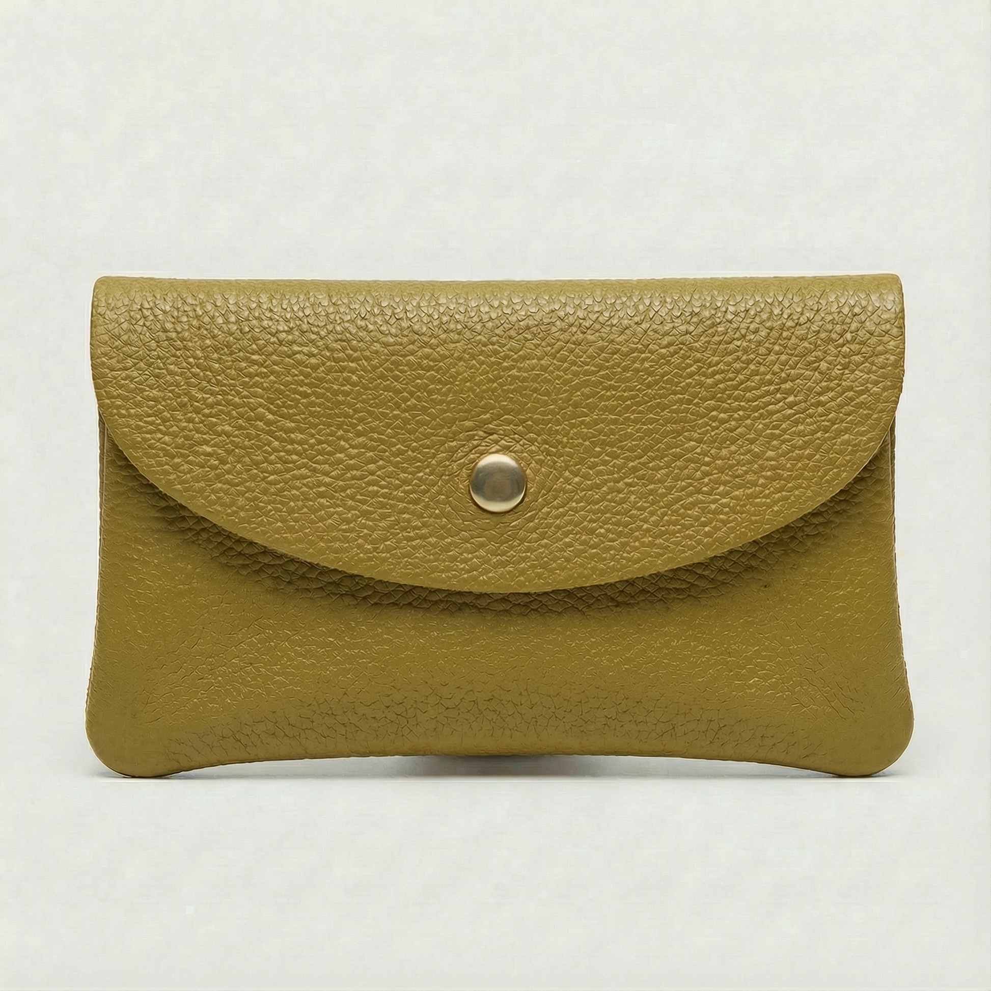 Chartreuse leather wallet with a gold button on a light gray background