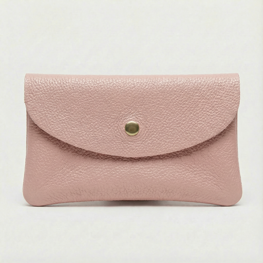 Dusty Pink leather wallet with a gold clasp on a light gray background
